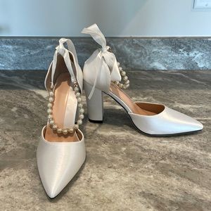 Special occasion shoe. Never worn. No box.  Size 9.5 or EU 41. White